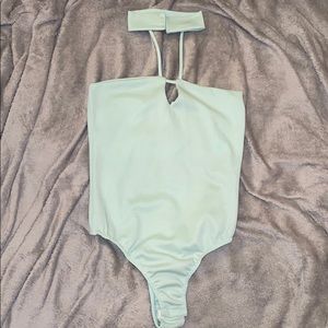 Green no sleeves turtleneck bodysuit